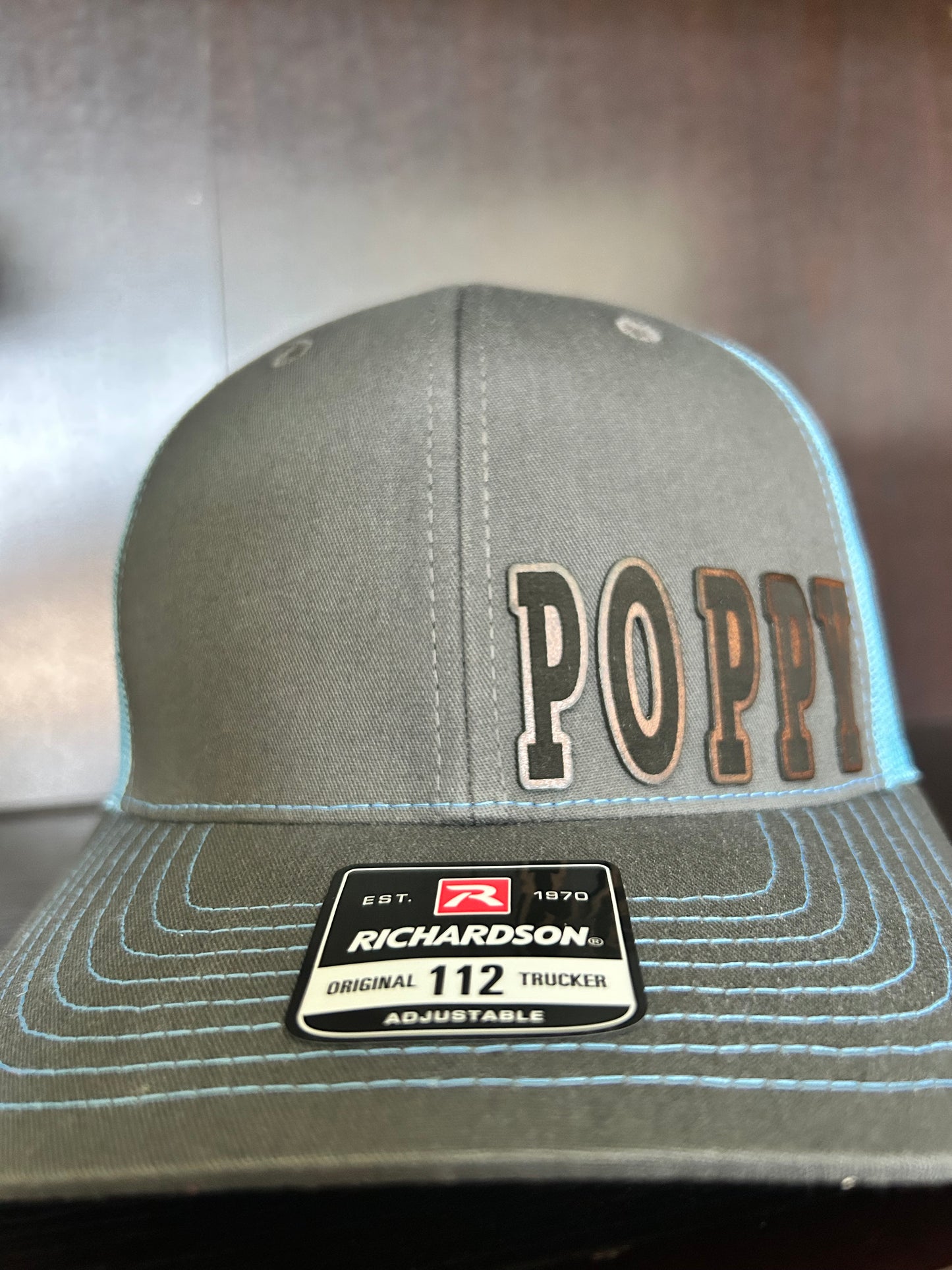 “D A D" custom leather patch on Trucker Hat Charcoal/Columbia Blue