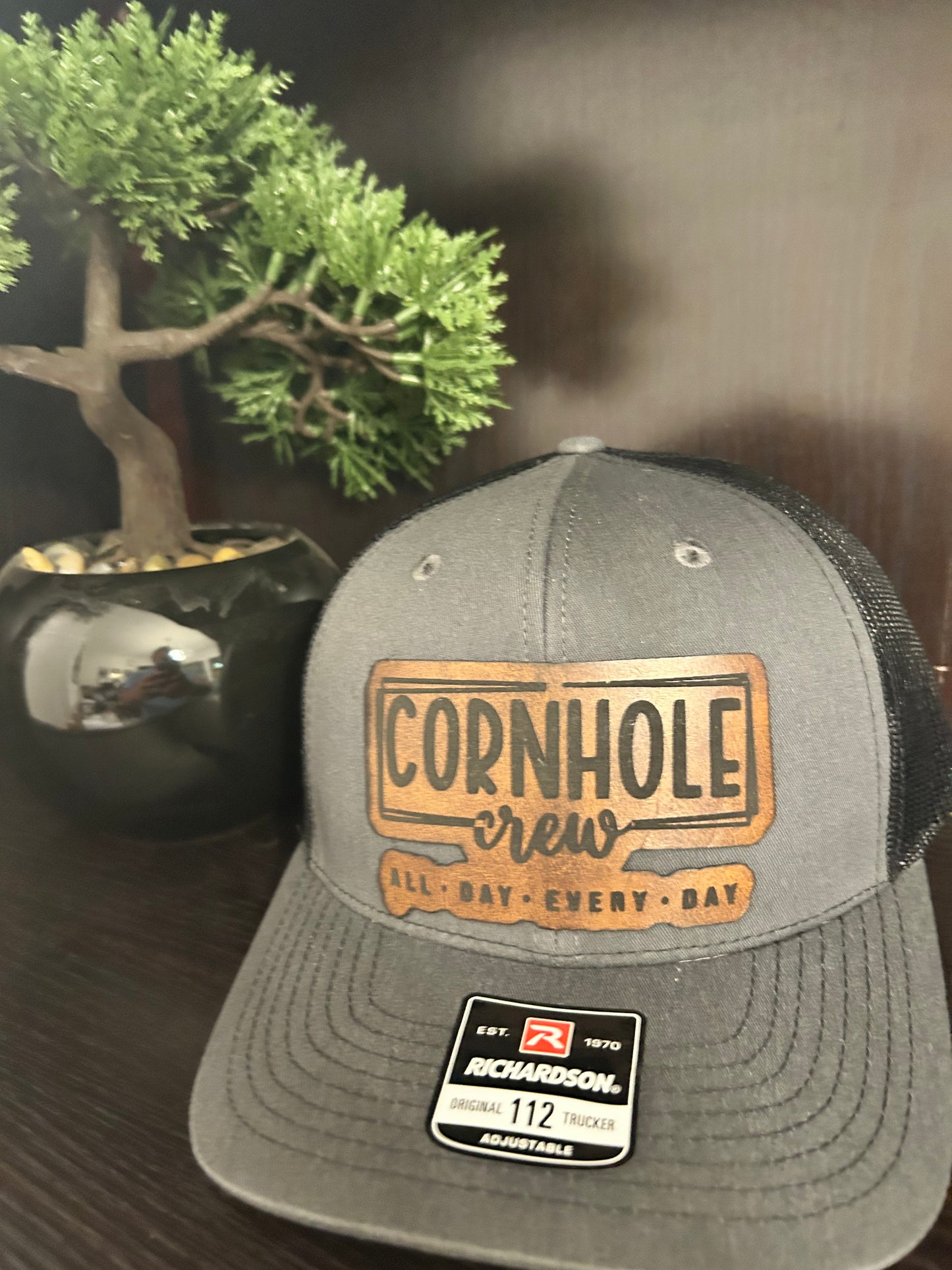 “Cornhole Crew All Day Everyday" custom leather patch on Trucker Hat Charcoal/Black