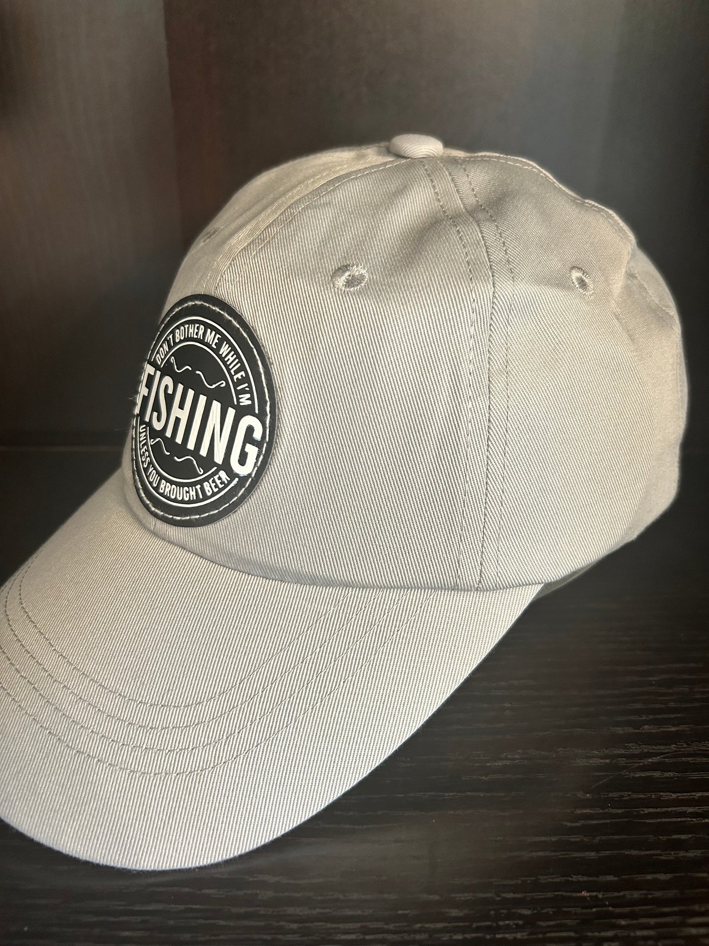 "Don't bother me while I'm FISHING unless you brought a beer" hat.