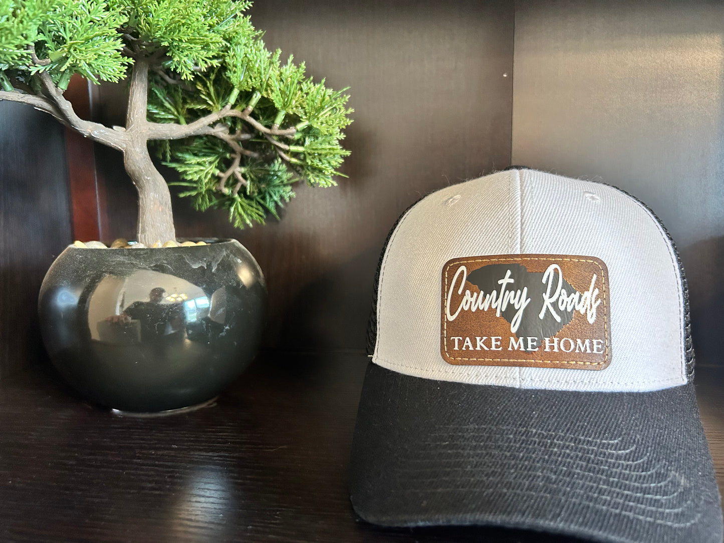 "Country Roads Take Me Home" with SC Background Patch on Trucker Hat
