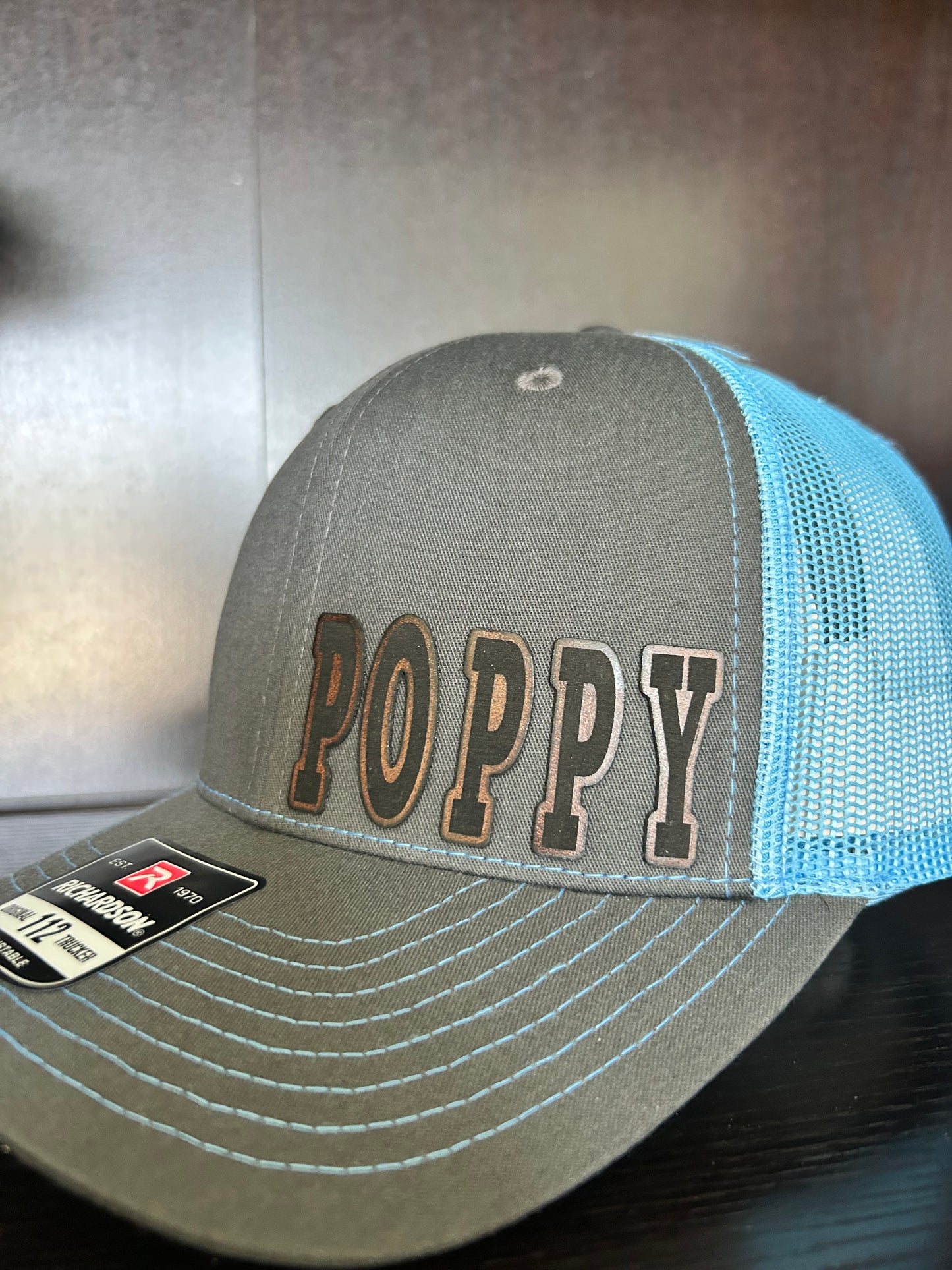 “D A D" custom leather patch on Trucker Hat Charcoal/Columbia Blue