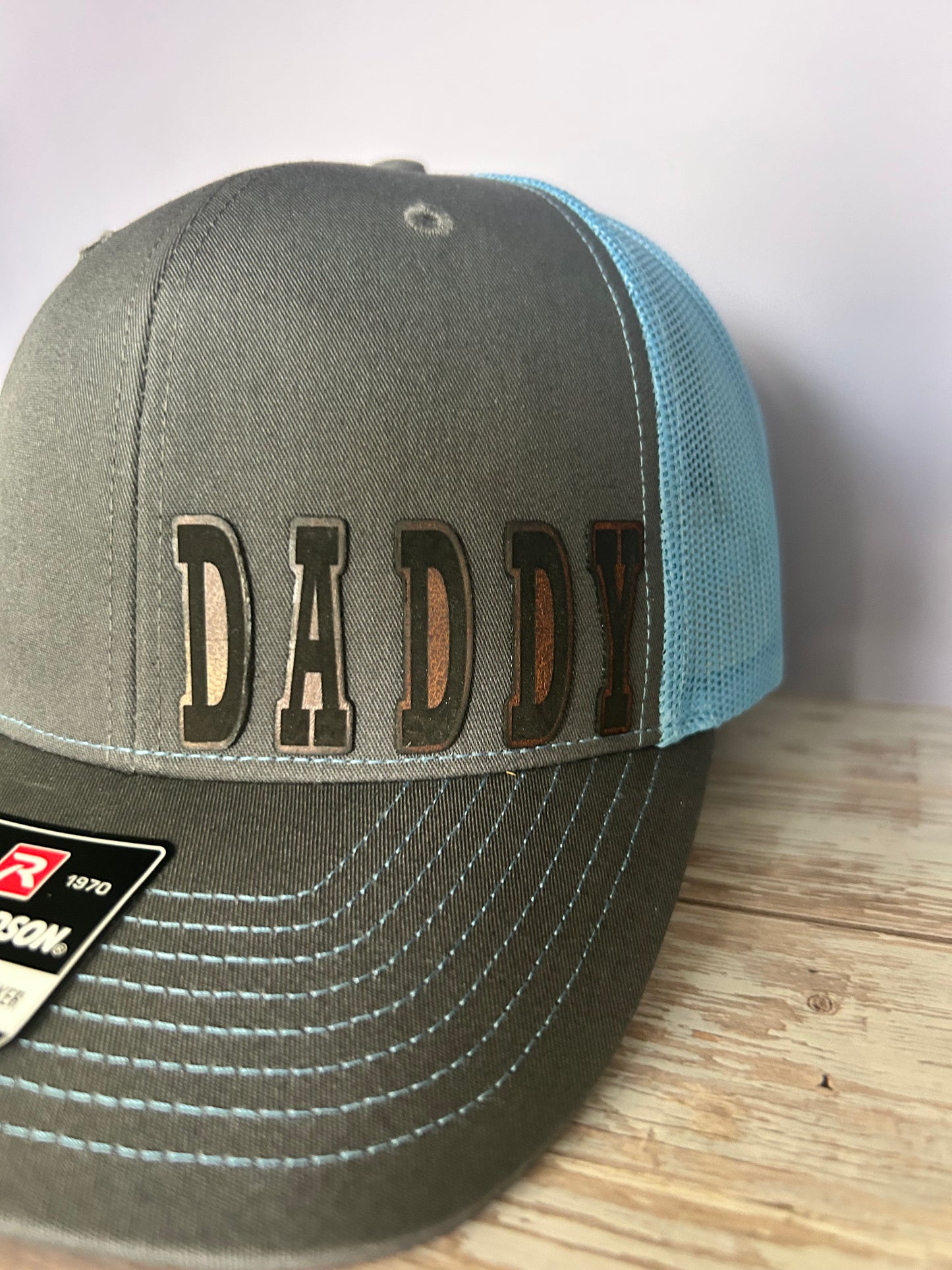 “D A D" custom leather patch on Trucker Hat Charcoal/Columbia Blue
