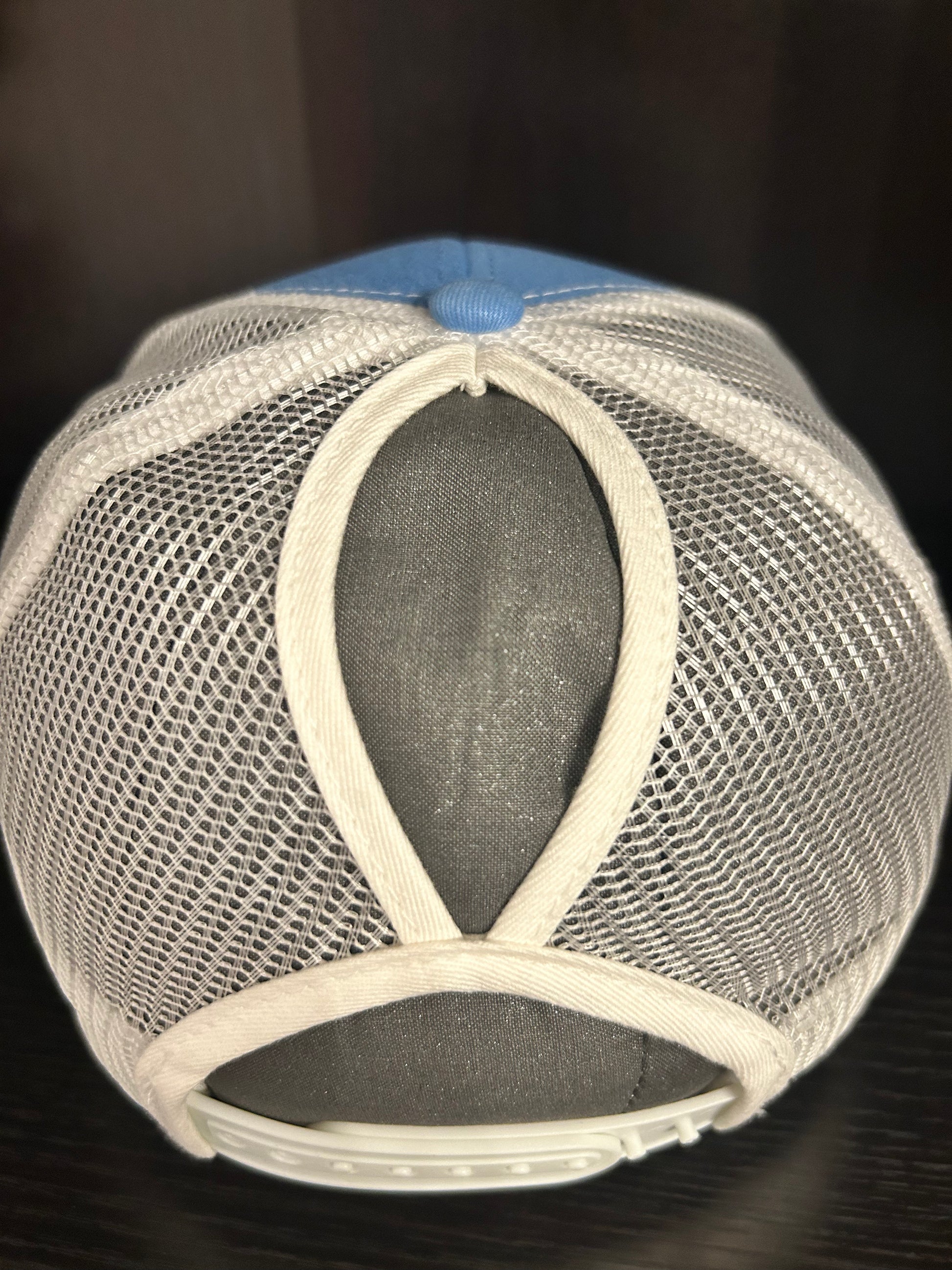 “Mama" on custom leather patch on a Trucker Hat with Pony Tail hole in the back Columbia Blue/White