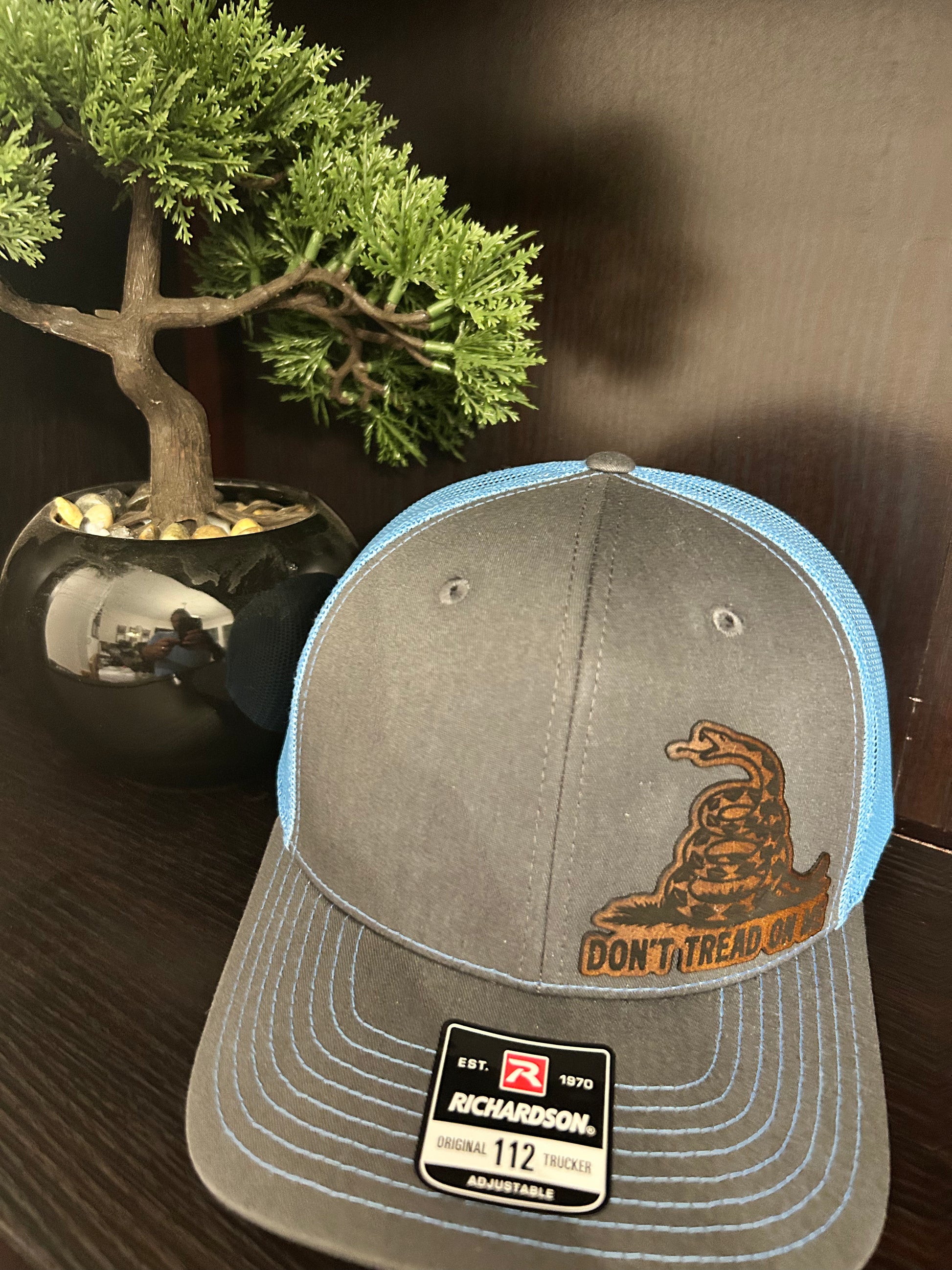 “Don’t Tread On Me" custom leather patch on Trucker Hat Charcoal/Columbia Blue