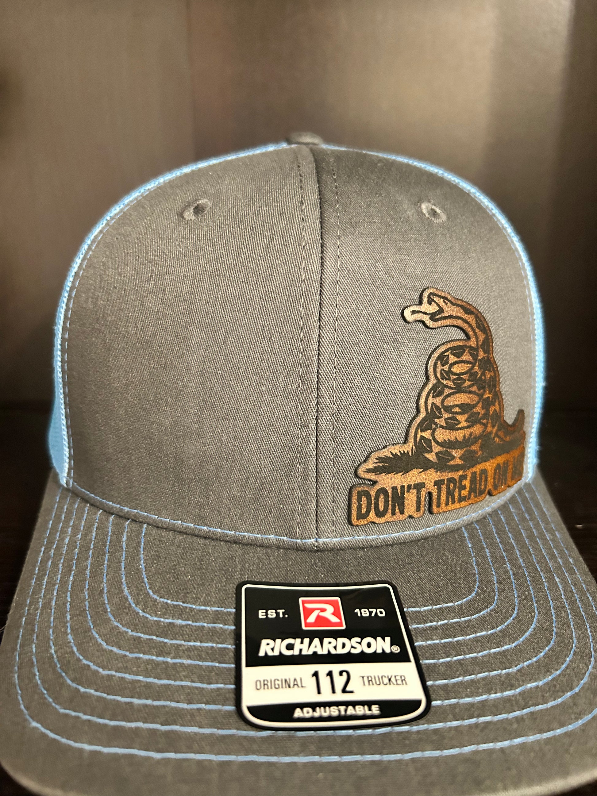 “Don’t Tread On Me" custom leather patch on Trucker Hat Charcoal/Columbia Blue
