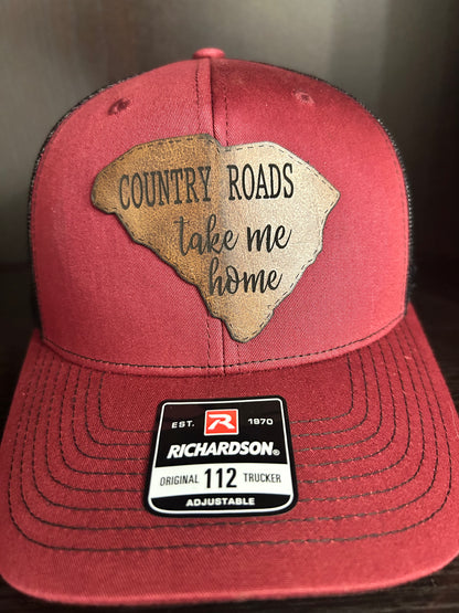 "Country Roads Take Me Home" on a SC shaped leather Patch on Trucker Hat Maroon/Black