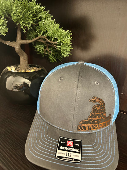 “Don’t Tread On Me" custom leather patch on Trucker Hat Charcoal/Columbia Blue