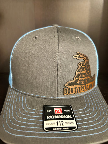 “Don’t Tread On Me" custom leather patch on Trucker Hat Charcoal/Columbia Blue