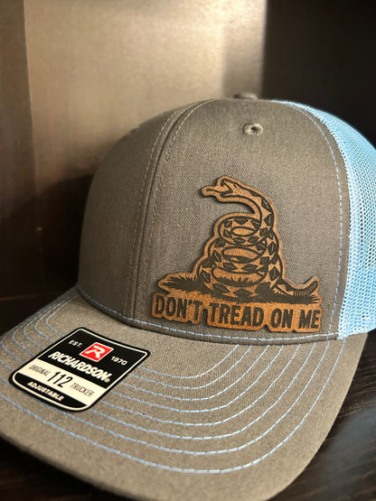 “Don’t Tread On Me" custom leather patch on Trucker Hat Charcoal/Columbia Blue