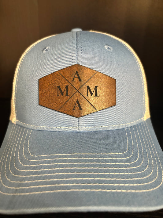 “Mama" on custom leather patch on a Trucker Hat with Pony Tail hole in the back Columbia Blue/White
