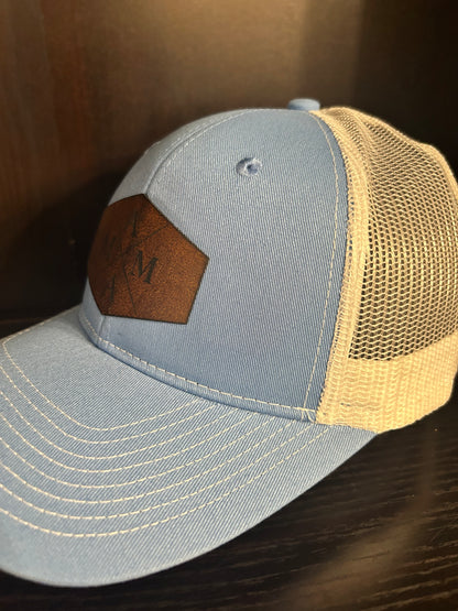 “Mama" on custom leather patch on a Trucker Hat with Pony Tail hole in the back Columbia Blue/White