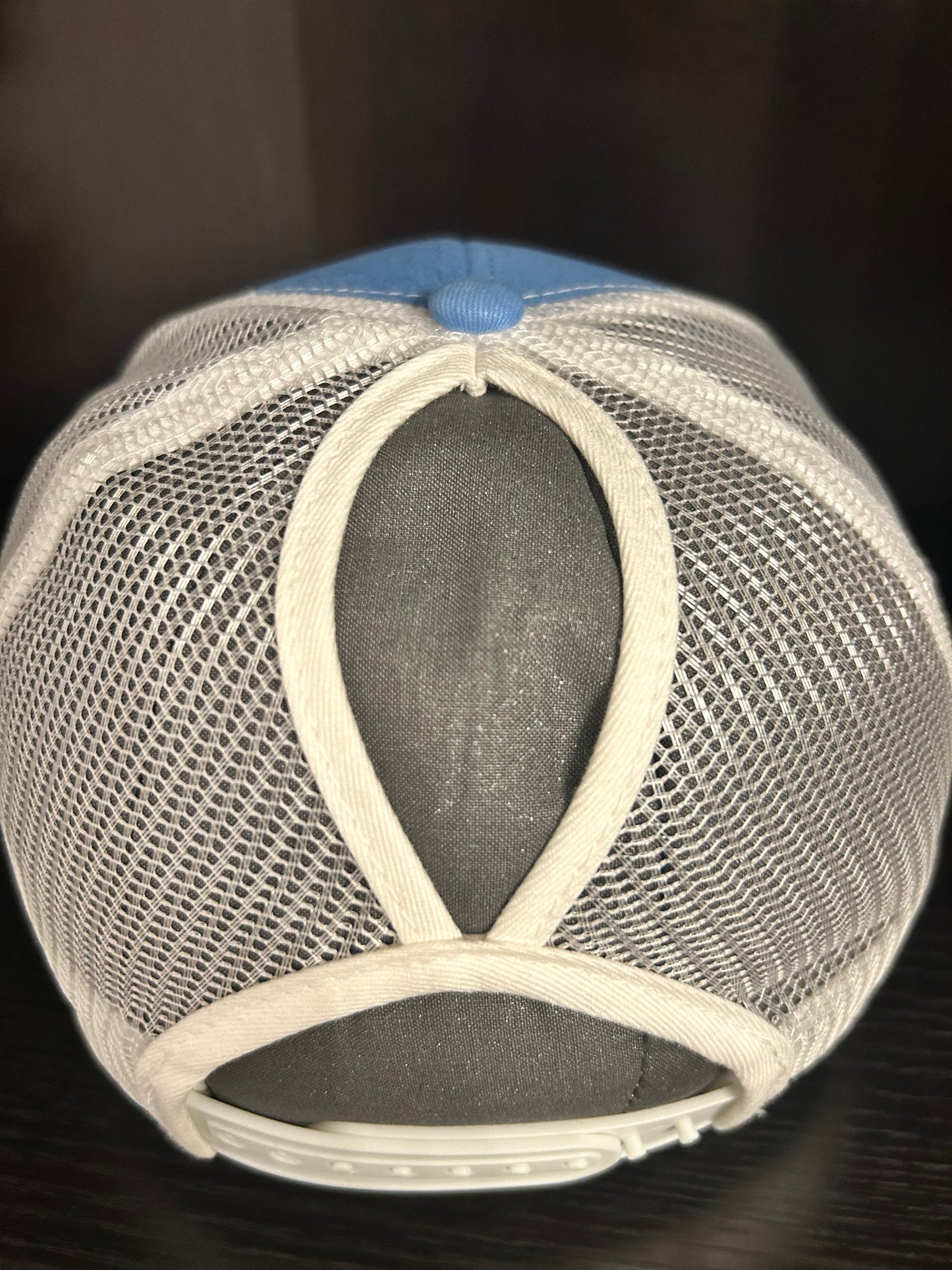 “Mama" on custom leather patch on a Trucker Hat with Pony Tail hole in the back Columbia Blue/White