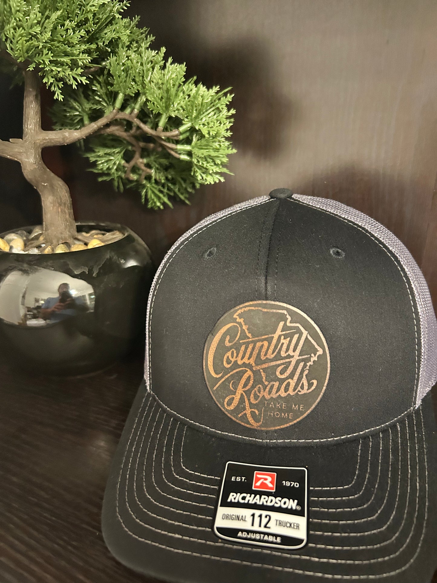 “Country Roads Take Me Home" custom leather patch on Trucker Hat Black/Charcoal