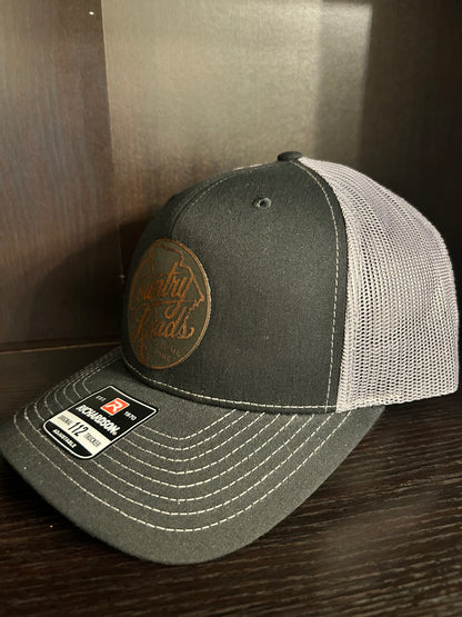“Country Roads Take Me Home" custom leather patch on Trucker Hat Black/Charcoal