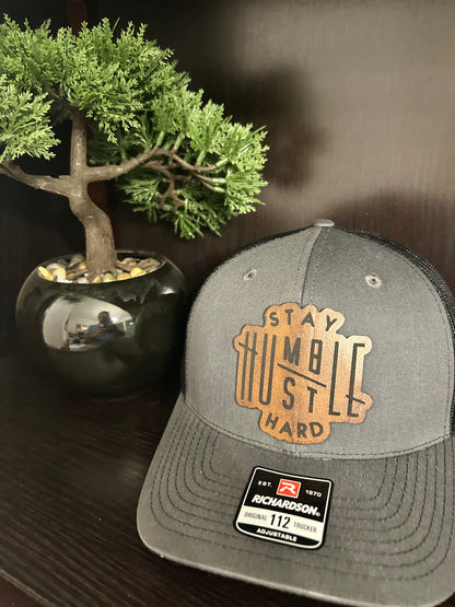 “Stay Humble Hustle Hard" custom leather patch on Trucker Hat Charcoal/Black
