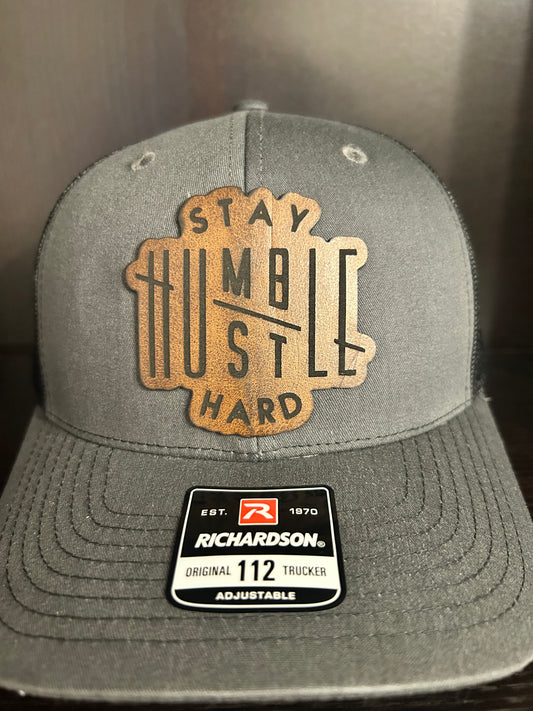 “Stay Humble Hustle Hard" custom leather patch on Trucker Hat Charcoal/Black