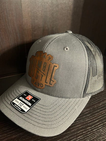 “Stay Humble Hustle Hard" custom leather patch on Trucker Hat Charcoal/Black
