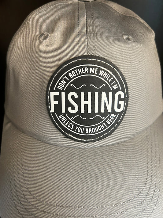 "Don't bother me while I'm FISHING unless you brought a beer" hat.
