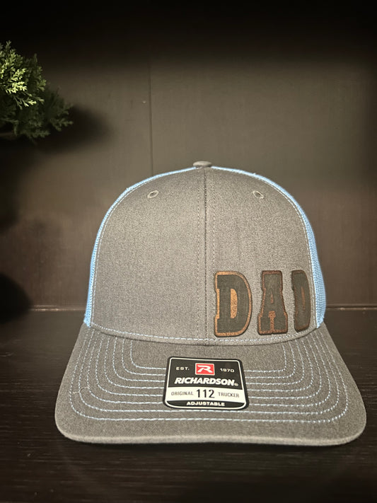 “D A D" custom leather patch on Trucker Hat Charcoal/Columbia Blue