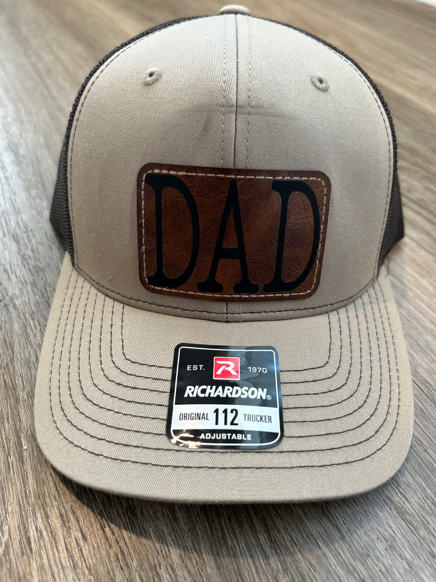 "DAD" on Rustic Leather Patch Trucker Hat