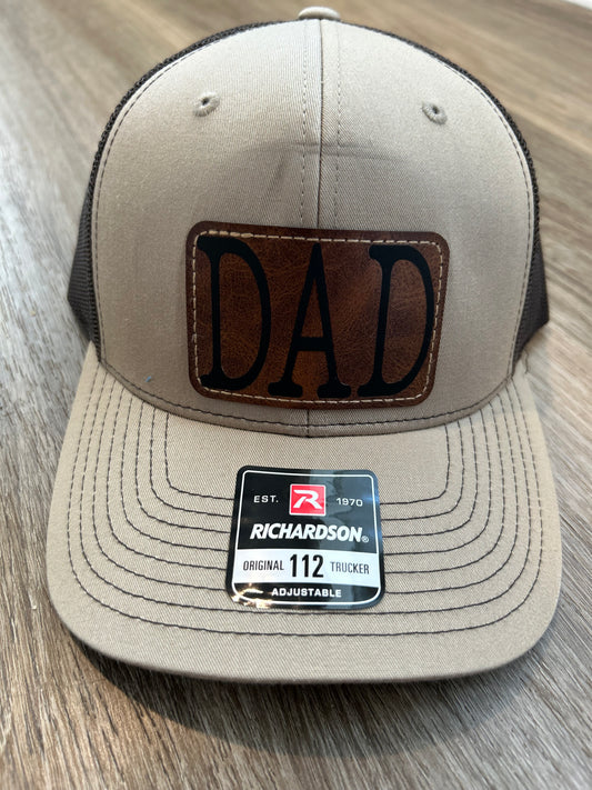 "DAD" on Rustic Leather Patch Trucker Hat